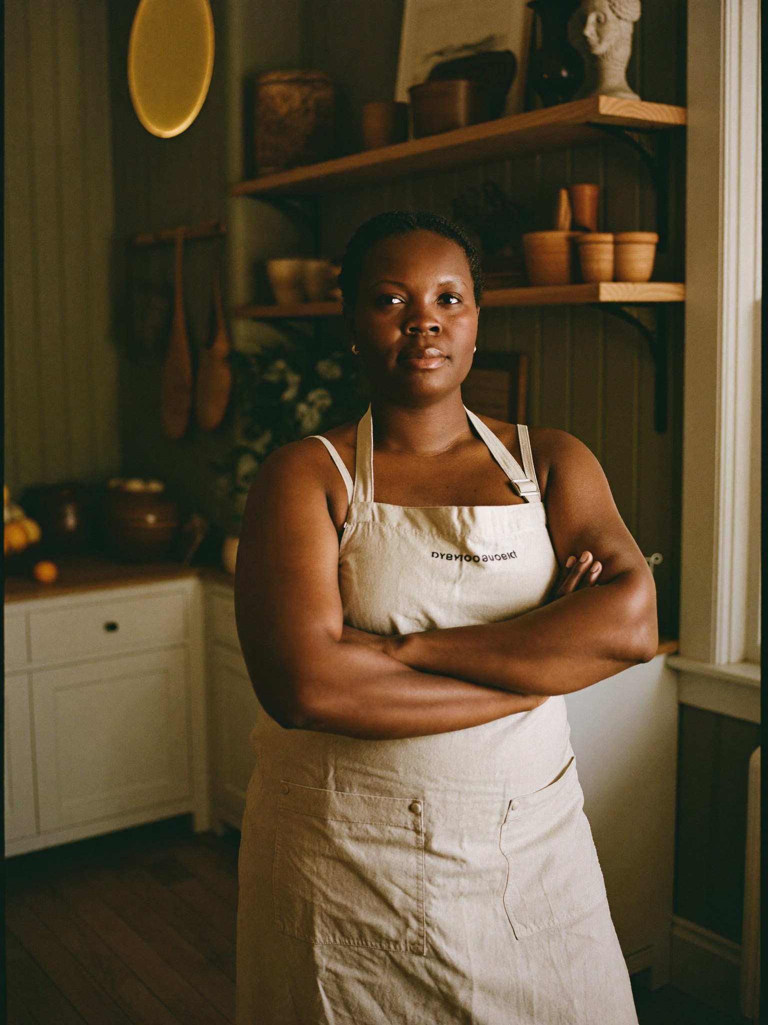 A founder standing proudly in her boutique studio